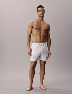 Boxer mare Beachwear bianchi in tessuto elasticizzato con nastro logato - Calvin Klein - FashionsVida