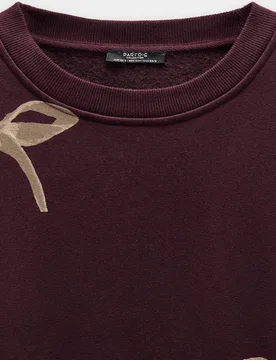 Sudadera de mujer sin capucha con estampado de lazos - Parfois - FashionsVida