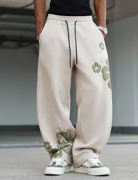Pantalones de chándal holgados de pierna ancha con cordón en la cintura, bolsillos y estampado de letras y flores para hombre, pantalones de flores - Shein - FashionsVida