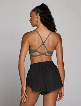Sujetador deportivo Tempo de espalda cruzada ajustable para mujer de MP - oscuro - XS - MyProtein - FashionsVida