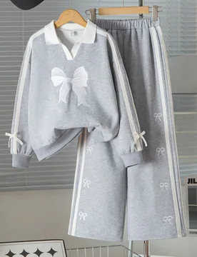Conjunto de sudadera con cuello en V bordada con lazo y pantalones rectos a juego con raya lateral, look casual de otoño/invierno para niñas con est - Shein - FashionsVida
