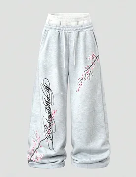 Pantalones de chándal de primavera con cintura con cordón, sueltos, de pierna ancha y con estampado de flores de cerezo - Shein - FashionsVida