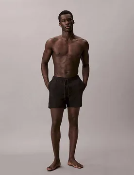 Boxer mare Beachwear neri in tessuto elasticizzato con nastro logato - Calvin Klein - FashionsVida