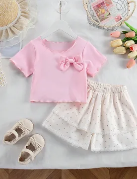 Set de 2 piezas de top casual chic con decoración de lazo en color rosa suave y falda pantalón con volantes de encaje en tono apricot para niñas j? - Shein - FashionsVida