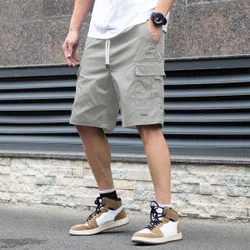 Pantalones cortos casuales de unicolor con bolsillo y cordón para hombres