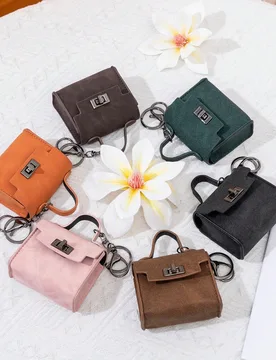 CHARM INFINITE Llavero con candado giratorio vintage mini, colgante de bolso, caja portátil de almacenamiento de auriculares de cuero PU, monedero, d - Shein - FashionsVida