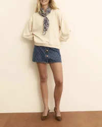 Mini gonna in denim di cotone con bottoni bijoux e laserature a rombi
