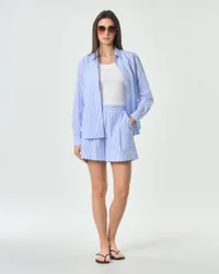 Pantaloncini corti in cotone a righe strette bianche e azzurre con elastico in vita