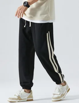 Pantalones de chándal de corte holgado minimalista con bolsillo trasero, diseño de raya lateral, cintura cómoda con cordón, pantalones casuales ve - Shein - FashionsVida