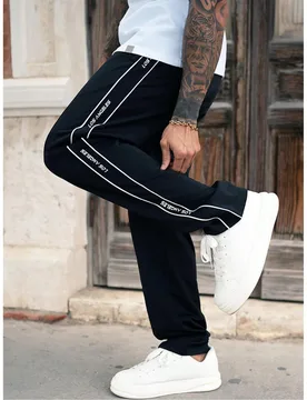 Pantalones de chándal anchos y holgados negros para hombre, joggers de estilo urbano con ajuste suelto, pantalones casuales cómodos, adecuados para - Shein - FashionsVida