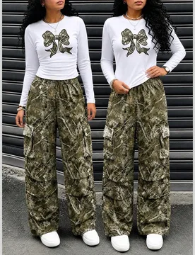 Set de 2 piezas con pantalón de camuflaje y blusa de manga larga con estampado de moño para niñas - Shein - FashionsVida