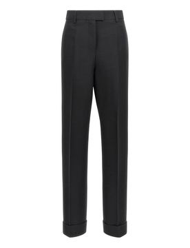 Pantaloni a pieghe allungate