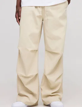 Herren Lange Hose mit elastischem Bund im Baggy-Stil Stone Größe Small - boohooMAN - FashionsVida