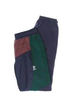 Pantalone Tuta Uomo Bld Colorblock Trackpant Shadow Navy/quiet Crimson/collegiate Green - Adidas - FashionsVida