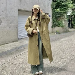 A new youthful versatile and comfortable long single-breasted checkered trench coat is in