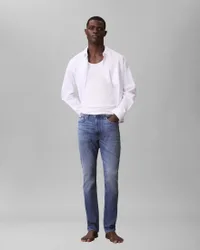Jeans skinny lavaggio medio in denim elasticizzato