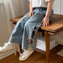 Jeans de mezclilla casual con moño para niña