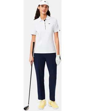 Polo de mujer de golf elástico de corte ajustado con protección UV en de manga corta - Lacoste - FashionsVida