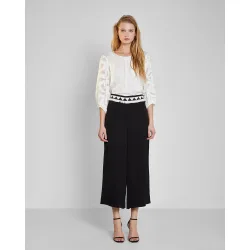Pantalones palazzo de mujer con cinturón de flecos