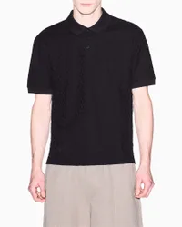 Polo Exchange nera in cotone con logo tono su tono jacquard