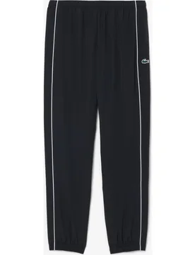 Pantalón de hombre de chándal de hombre deportivo hidrófugo con ribete en contraste en negro - Lacoste - FashionsVida