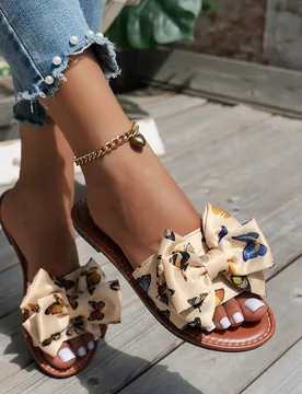 Sandalias deslizantes elegantes para mujer decoradas con un moño, de material suave, con punta redondeada y cómodas planas, apropiadas para el hogar - Shein - FashionsVida