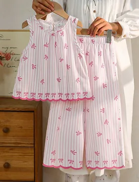 Conjunto de top sin mangas y pantalones de pierna ancha con elegantes rayas verticales y bordado floral en blanco y negro para niñas, adecuado para s - Shein - FashionsVida