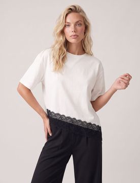 Blusa in cotone con finitura in pizzo e orlo asimmetrico - panna