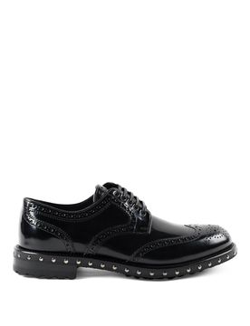 Brogue in pelle con borchiette