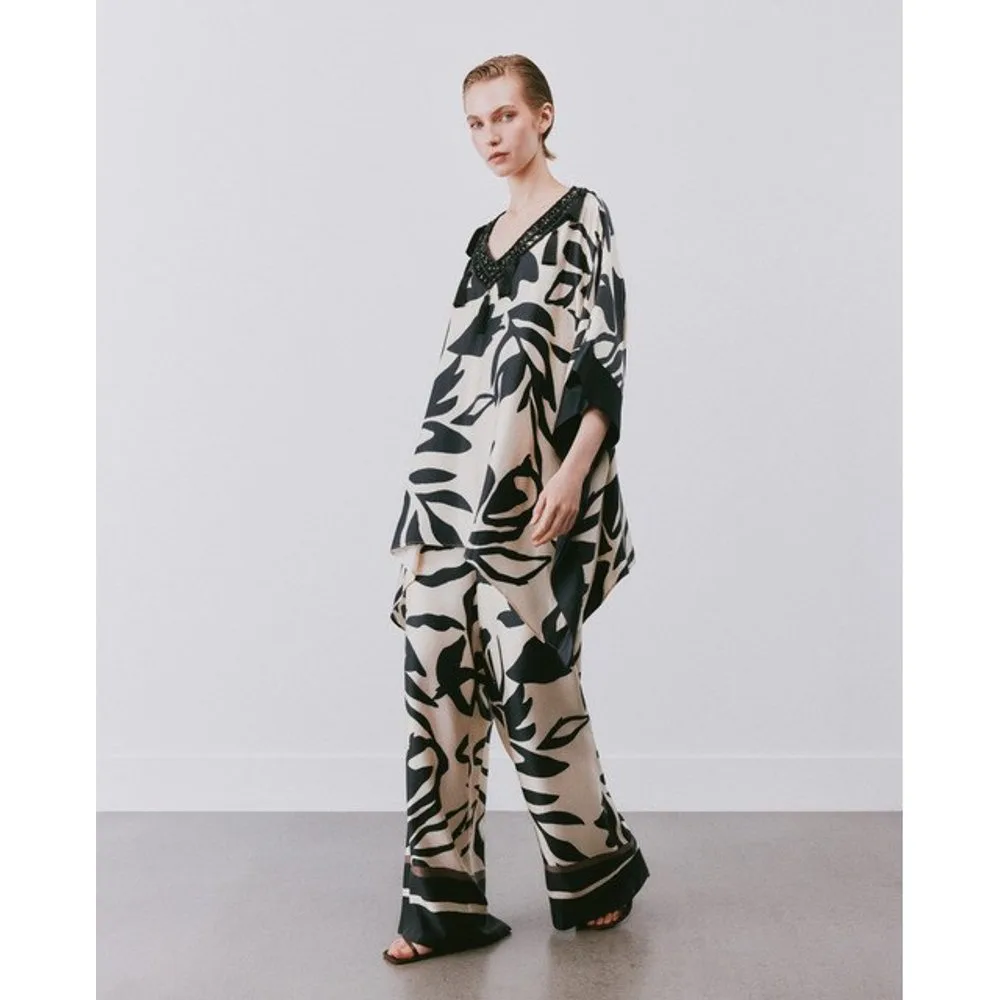 Conjunto de mujer dos piezas con estampado zócalo en pantalón - Woman Fiesta El Corte Inglés - FashionsVida
