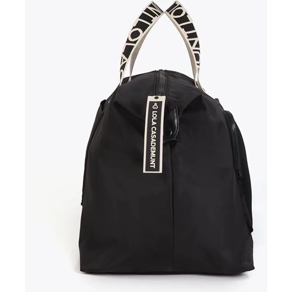 Bandolera de viaje de mujer con múltiples compartimentos y asa regulable - Lola Casademunt - FashionsVida