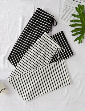 Set de 2 pantalones casuales de mujer de punto con estampado de rayas y cordón en la cintura, ropa de otoño e invierno - Shein - FashionsVida