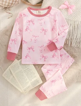 Conjunto de niña joven con top de punto suave de cuello redondo, manga larga y patrón de lazo, pantalones largos de cintura elástica y ajuste ceñi - Shein - FashionsVida