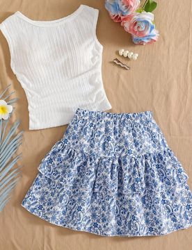 Este nuevo conjunto de 2 piezas para niñas preadolescentes presenta una elegante y cómoda blusa de punto jacquard azul de cuello redondo con un esti