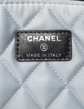 Medium Quilted Iridescent Calfskin Flower CC O Case Clutch - Chanel - FashionsVida