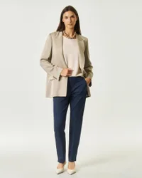 Pantaloni slim blu in gabardina stretch con piega stirata e spacco alla caviglia