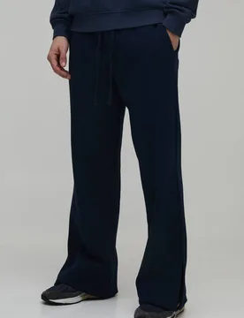 Herren Baggy Flared Fit Jogginghose mit geteiltem Saum Navy Größe Large - boohooMAN - FashionsVida