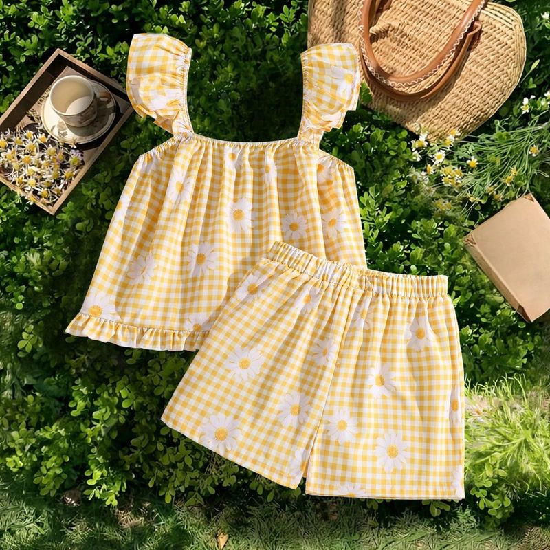 Conjunto de top sin mangas con estampado de cuadros y margaritas y shorts informales para niña preadolescente de vacaciones