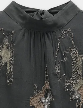 Blusa de mujer de manga larga fluida semitransparente con bordados y abalorios - Parfois - FashionsVida