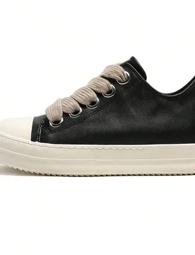 Par de zapatillas deportivas de estilo callejero unisex de caña baja, zapatos de cuero sintético con cordones y suela gruesa, con punta negra & blan - Shein - FashionsVida