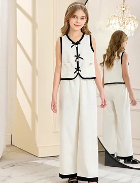 Conjunto de 2 piezas de top sin mangas y pantalones para niñas grandes en verano, con decoración de lazo retro en blanco y negro, chaleco con cuello - Shein - FashionsVida