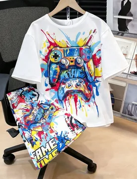 Set de 2 piezas de camiseta de manga corta con estampado de salpicaduras de colores + pantalones cortos con bolsillo para adolescentes, primavera/vera - Shein - FashionsVida