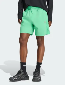 SHORT TECH TREFOIL ESSENTIALS POLIESTERE XL Semi Screaming Green - Adidas - FashionsVida