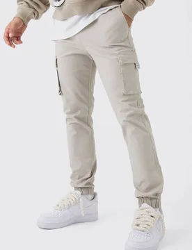 Herren Slim Fit Cargohose mit elastischem Bund und gewebten Bündchen Stone Größe Large - boohooMAN - FashionsVida
