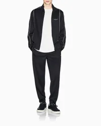 Pantaloni Exchange neri in misto cotone con logo stampato e profili a contrasto