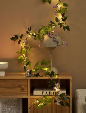 Ghirlanda luminosa LED con foglie e fiori - viola