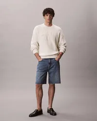Bermuda Jeans lavaggio scuro in cotone con orlo sfilacciato