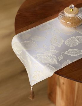 Runner da tavola con motivo vegetale metallizzato e nappe - panna
