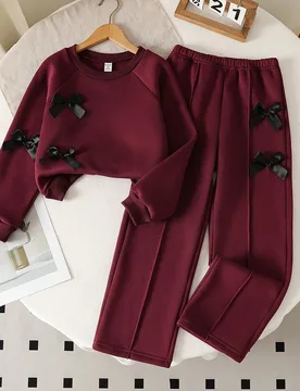 Set de 2 piezas de top de manga larga de cuello redondo gris y pantalones de pierna ancha con decoración de lazo para niñas jóvenes, otoño/inviern - Shein - FashionsVida