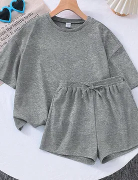 Set de 2 piezas: Camiseta de punto de cuello redondo holgada y pantalones cortos ajustados de punto de unicolor para niña joven - Shein - FashionsVida
